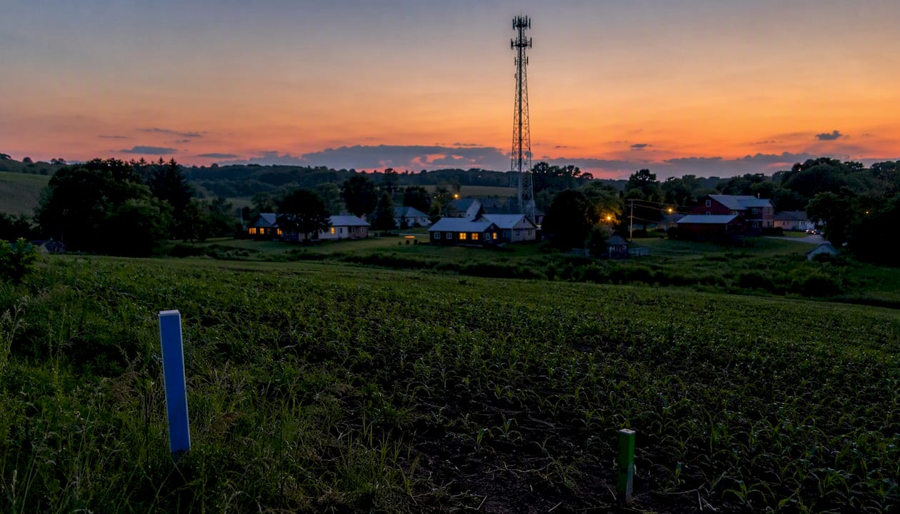 Telecom tower and small town landscape at dawn