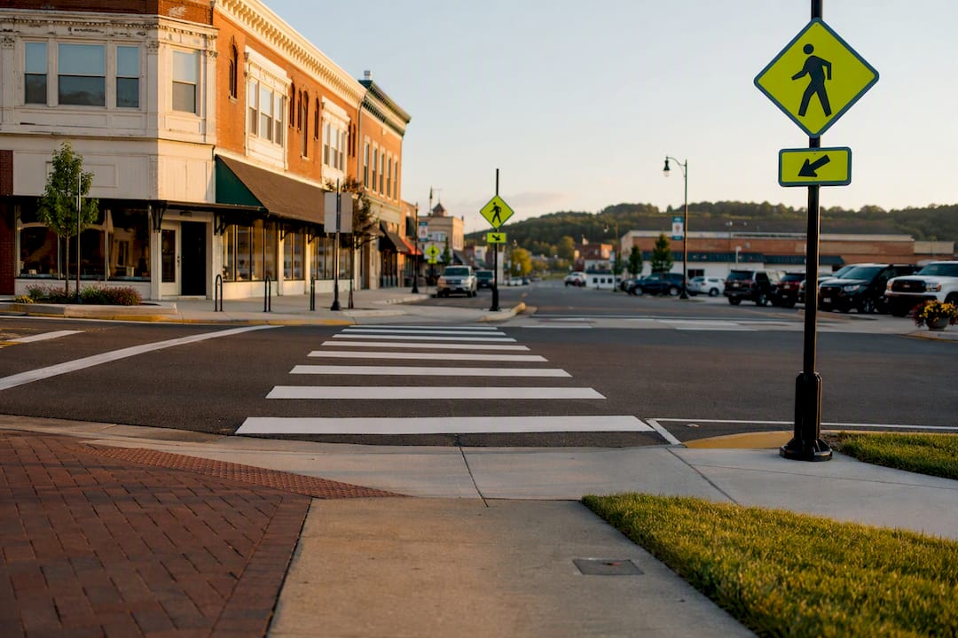 Small town streetscape with safe crossing and parking signs