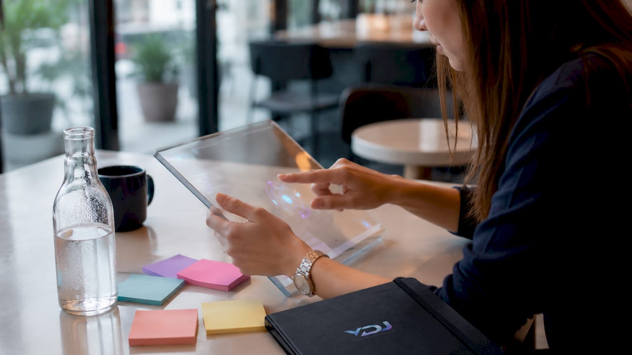 Hands testing micro-interactions on touchscreen tablet