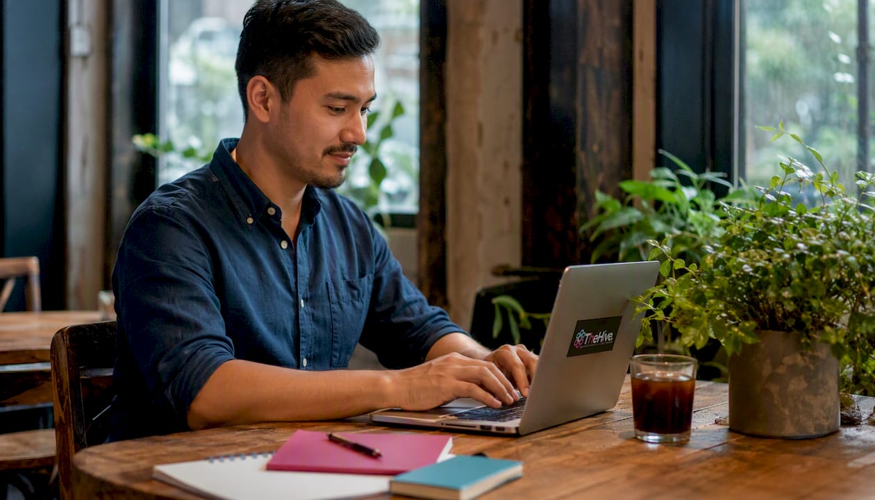 Hands typing on laptop setting up Google Business Profile