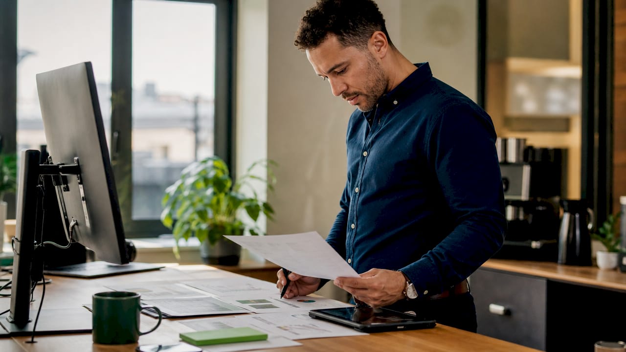 CPA working on expense classification in office