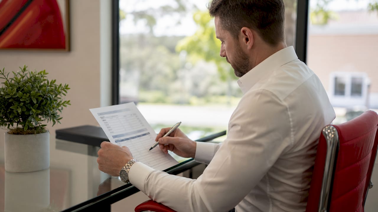 Advisor examining loan origination fees