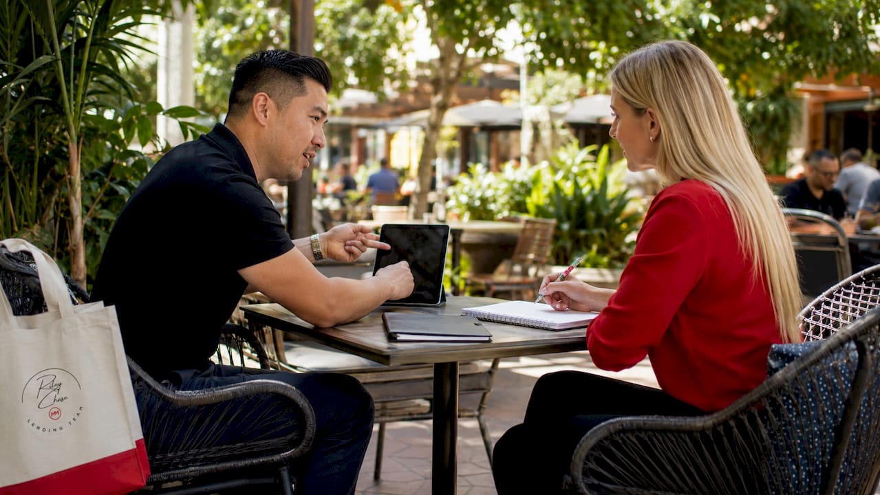 Couple discussing mortgage points at bank