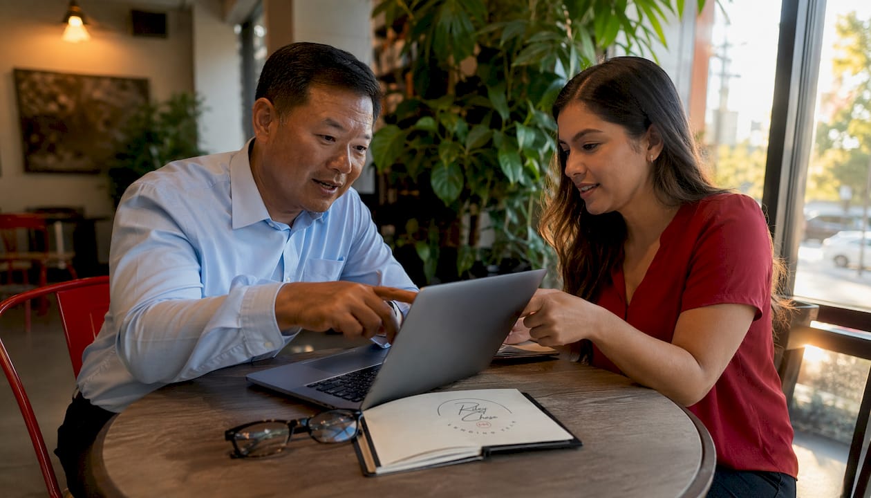 Foreclosure market expert consulting with colleague in office