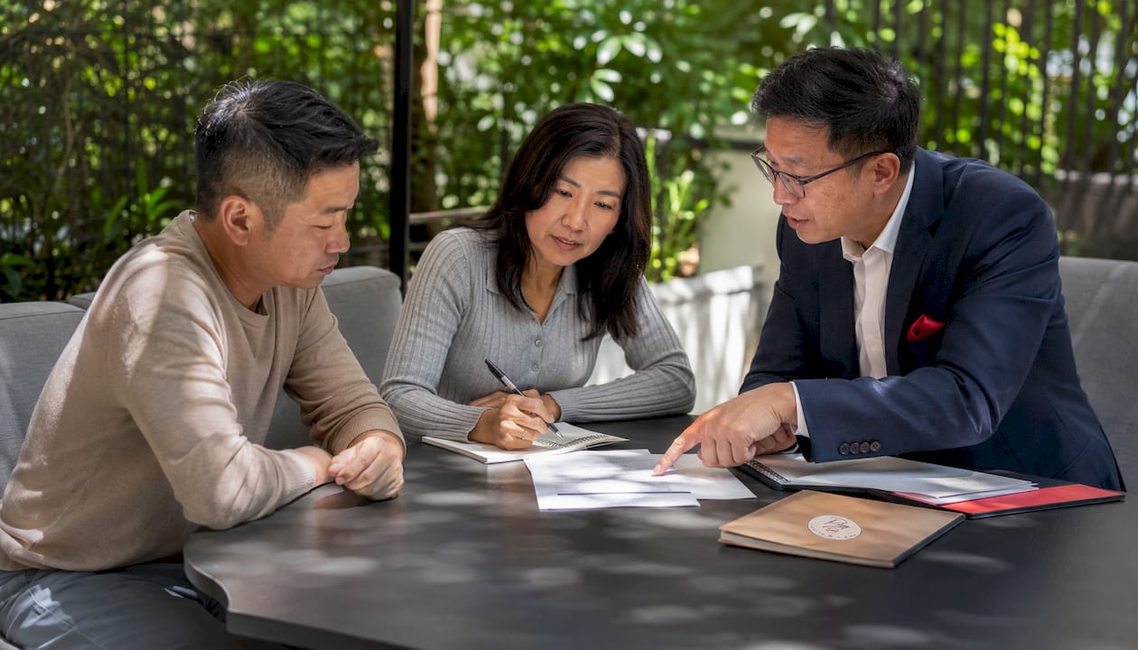 Couple consulting mortgage advisor about preapproval