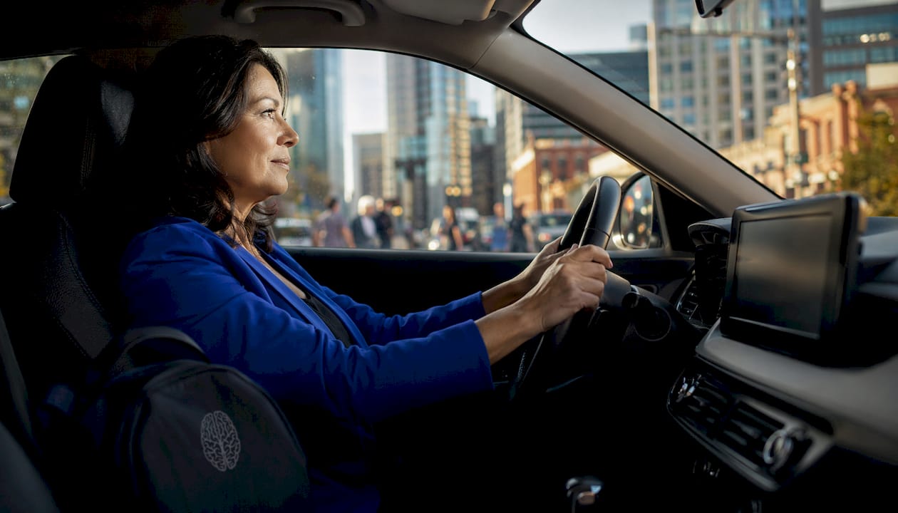 Calm driver sitting inside parked car