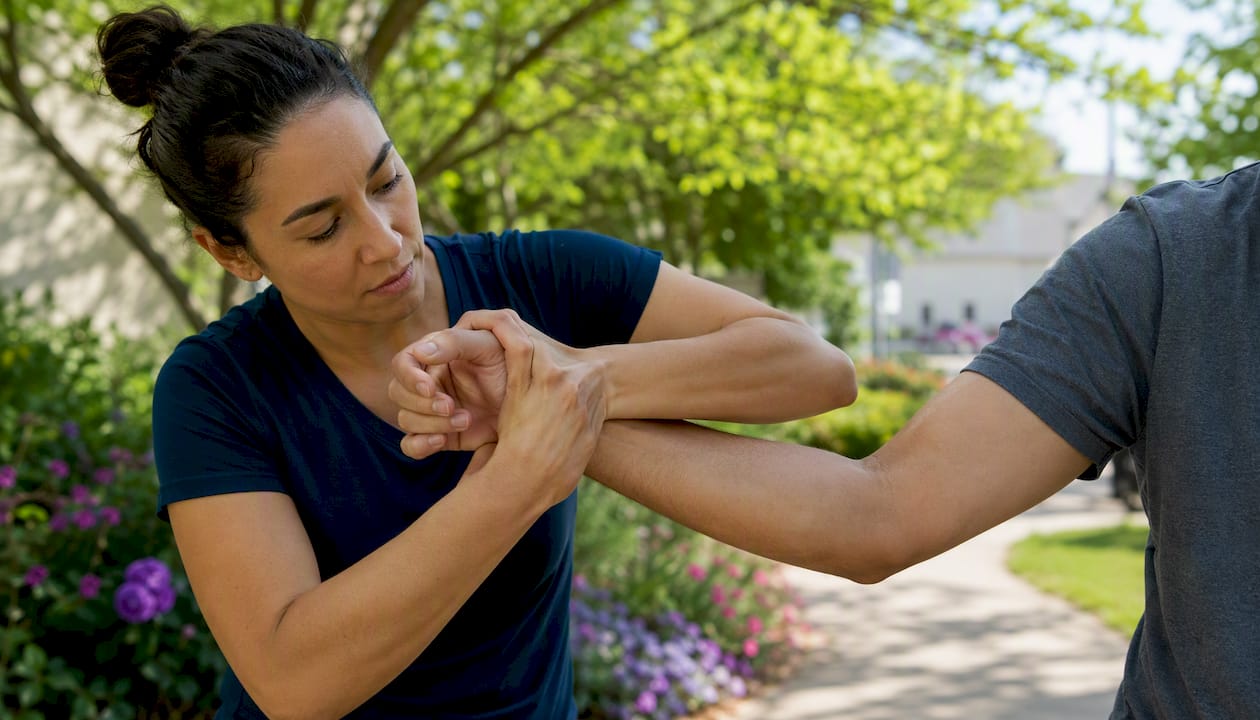 Healthcare worker practicing wrist release technique