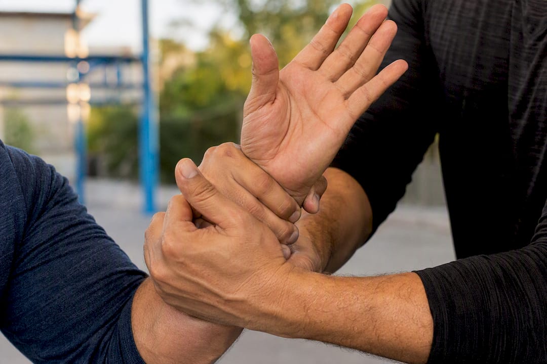 Close-up of hands breaking wrist grip