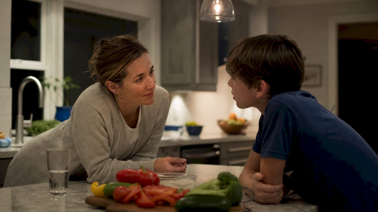 Parent checking in with child at home