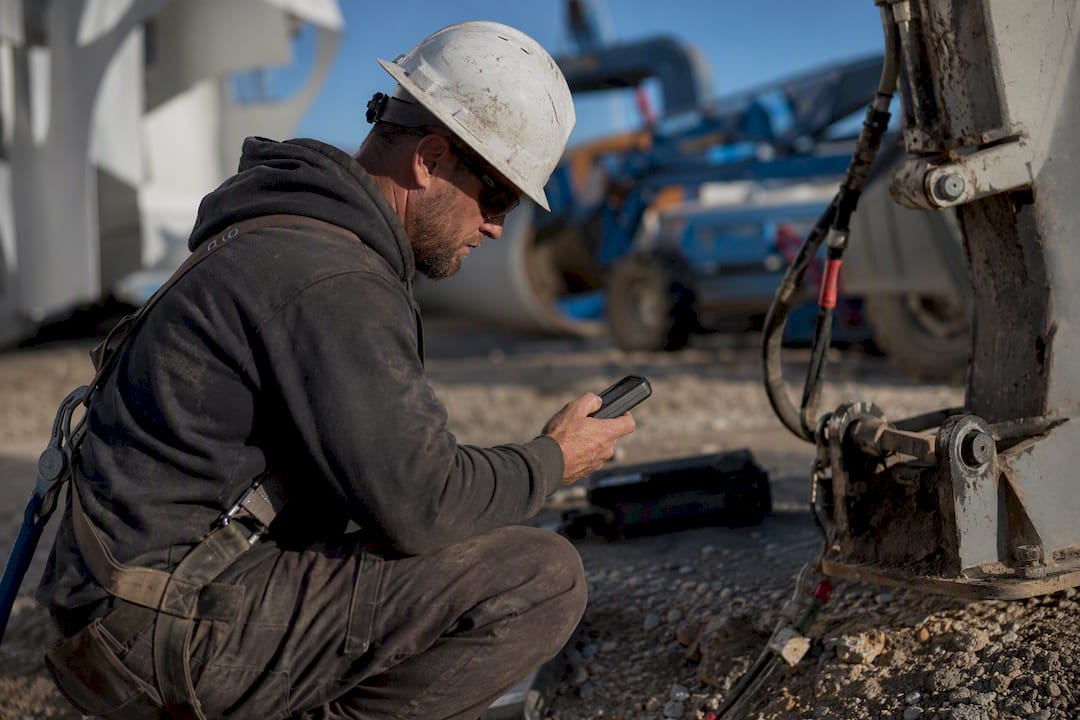 Lone worker performing safety check-in outdoors
