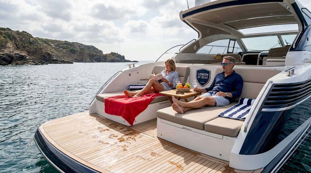Yacht guests relaxing on sun deck lounging