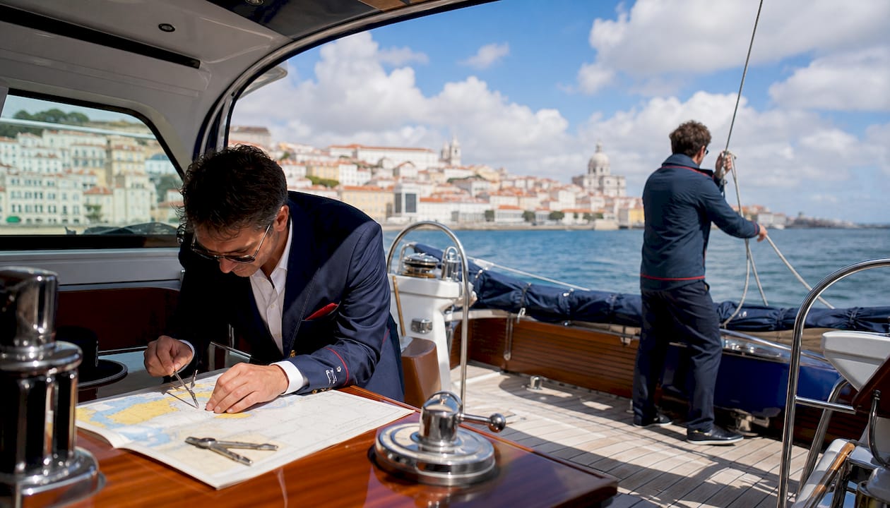 Crew members coordinating sailing tour operations