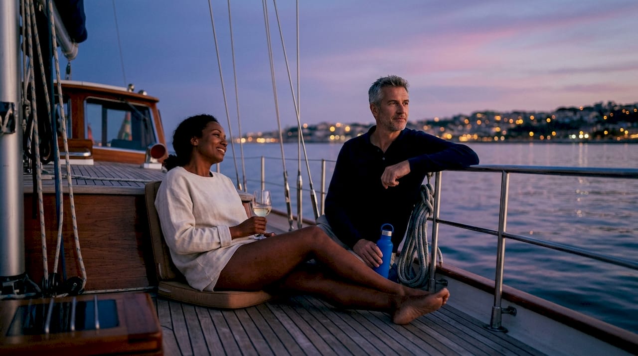 Couple enjoying sunset on evening cruise deck