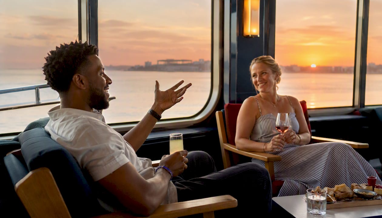 Guests enjoying private charter on catamaran table