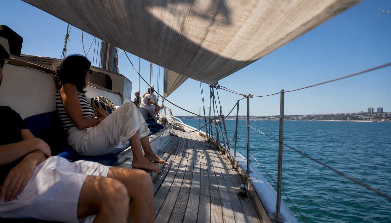 Shaded sailing boat deck with fluttering sail fabric