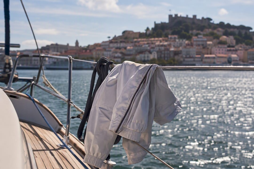 Light windbreaker on sailing boat deck railing