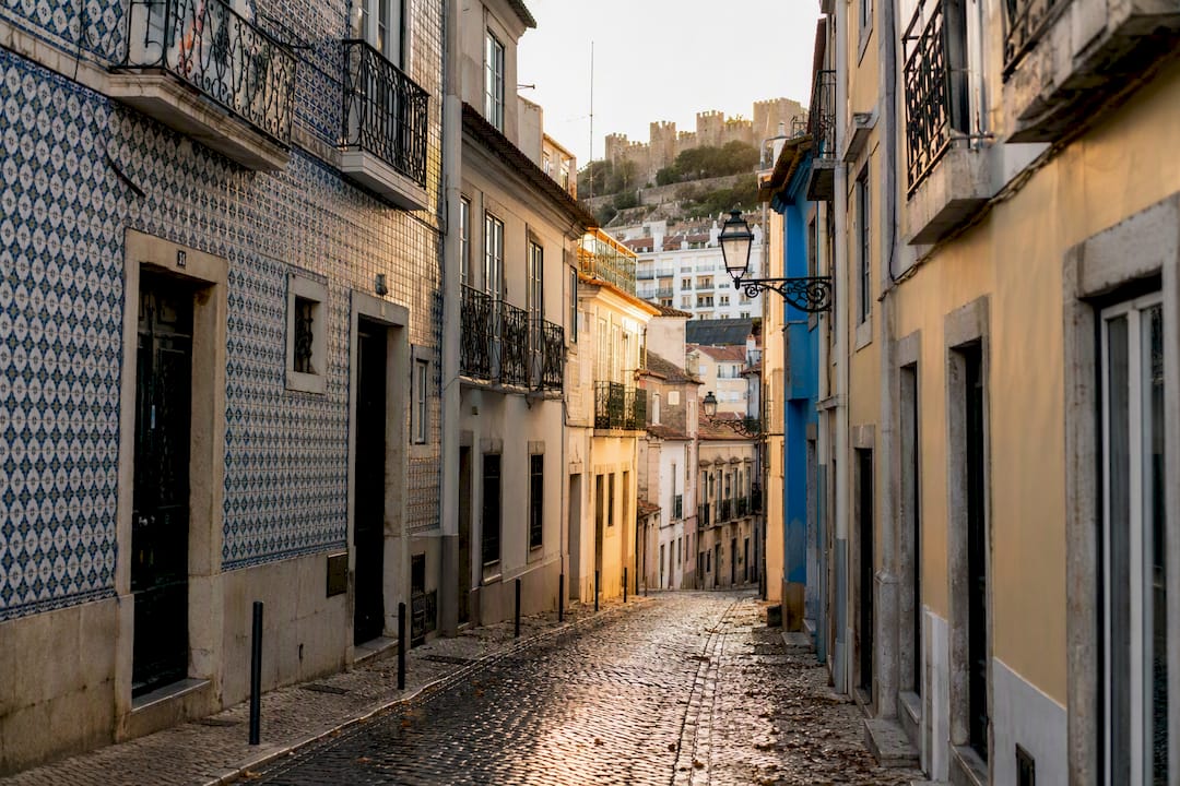 Alfama neighborhood sunny narrow street