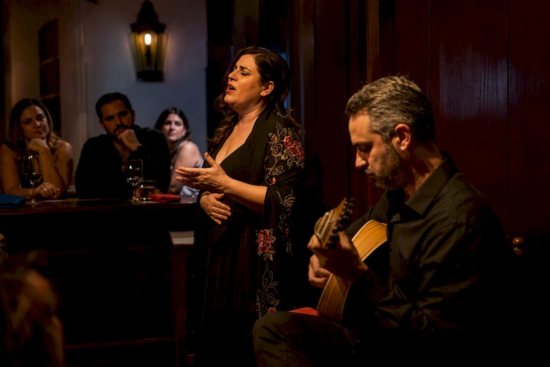Fado singer performing in Lisbon venue