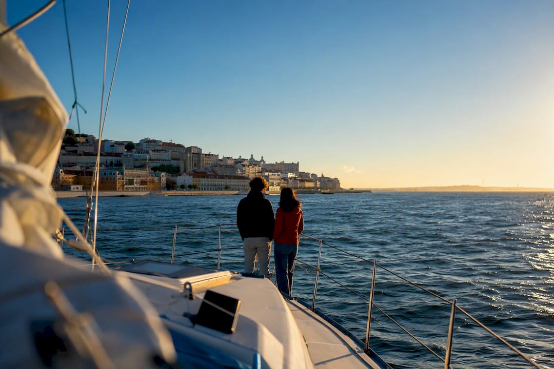 Sailors viewing Lisbon from the Tagus