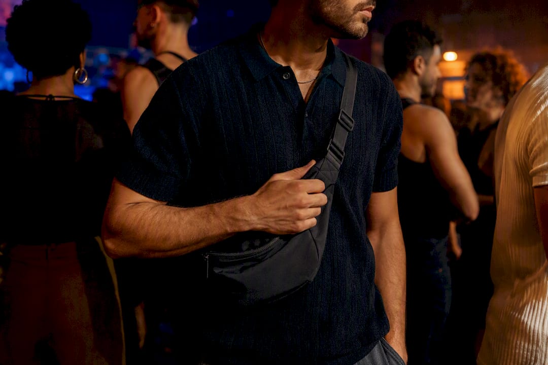 Crossbody bag secured in crowded club