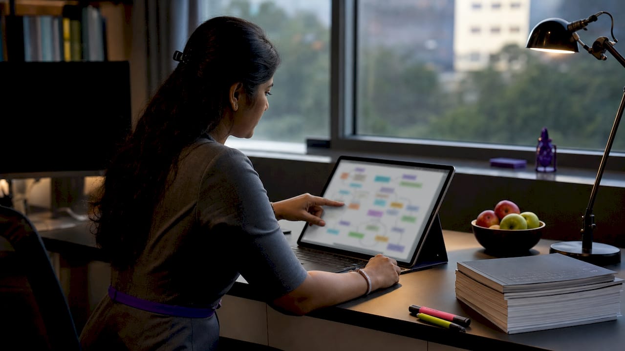 Researcher working with AI research workflow diagrams
