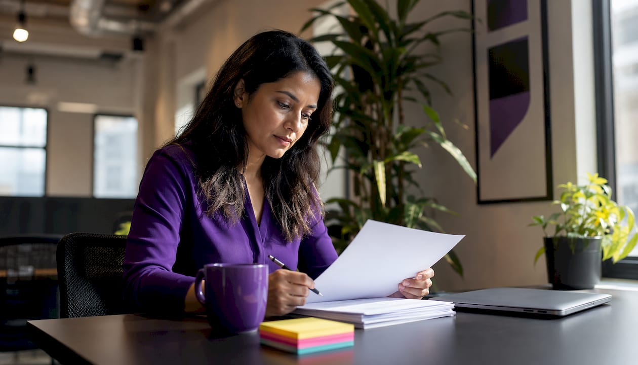 Researcher reviewing printed protocol documents