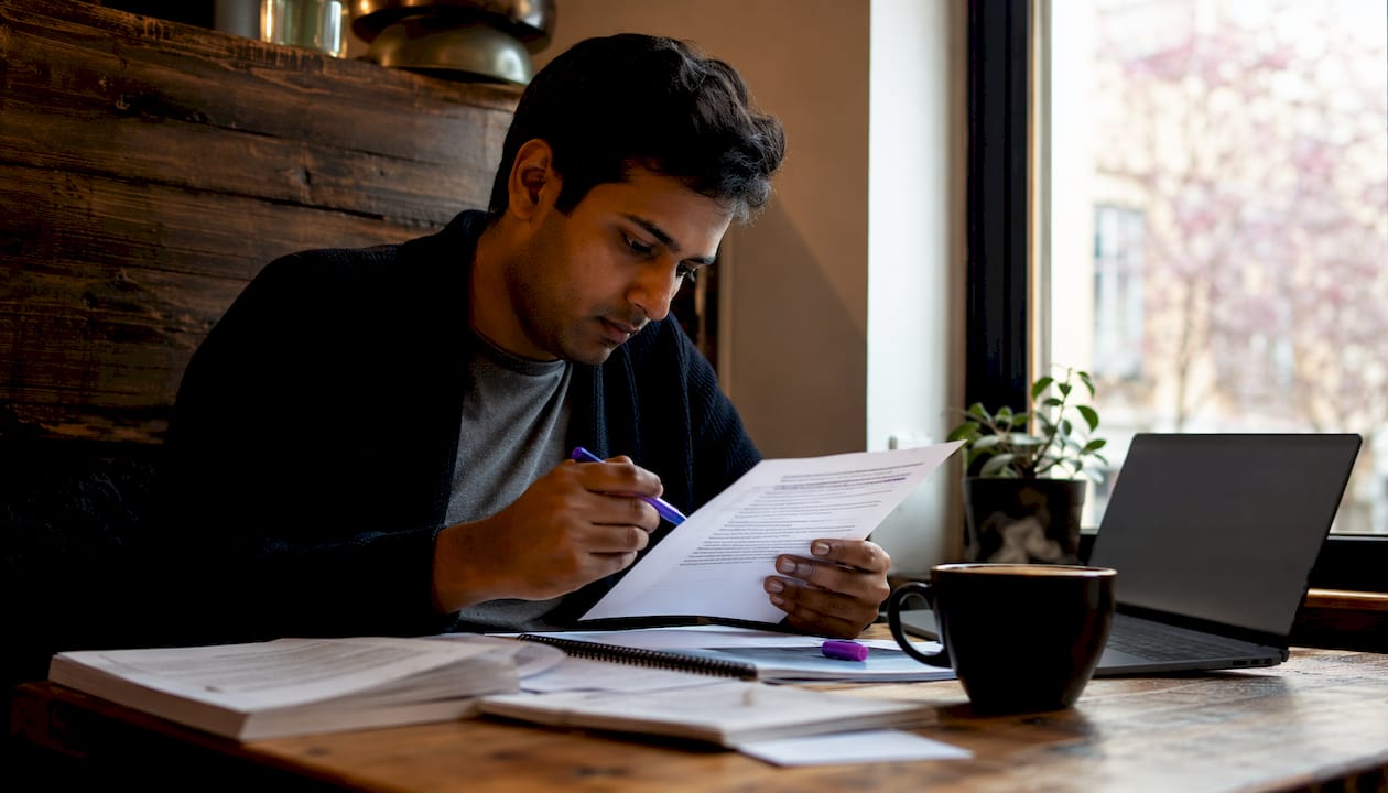 Researcher reviewing systematic review documents