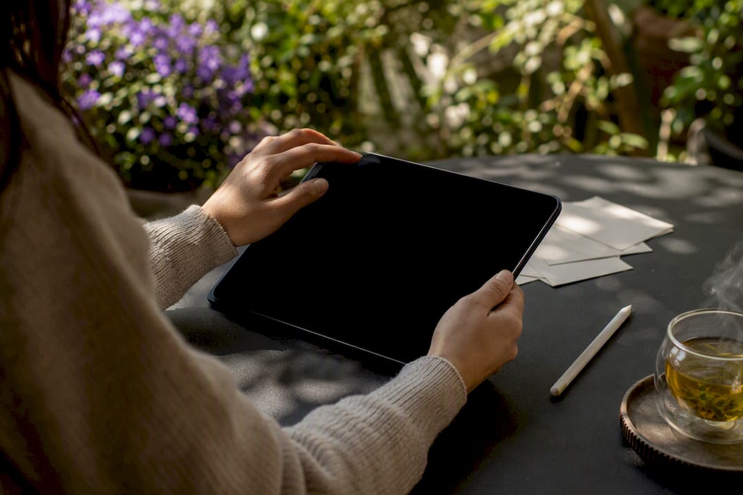 Hands managing digital data extraction form on tablet