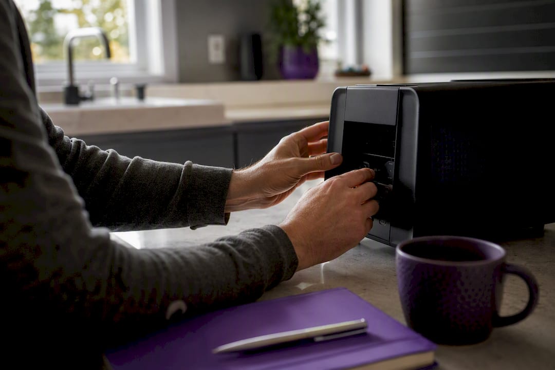 Hands setting up AI extraction device