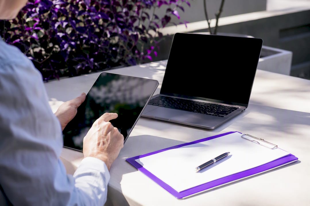 Hands poised for data verification on desk