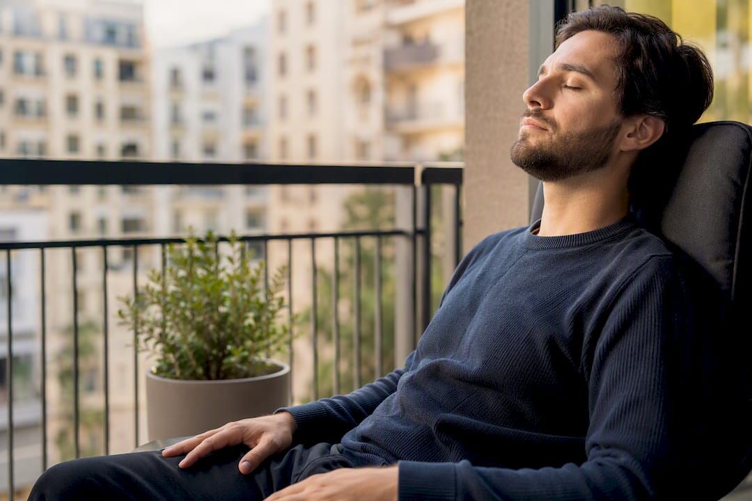 Person relaxing with eyes closed after oxygen use