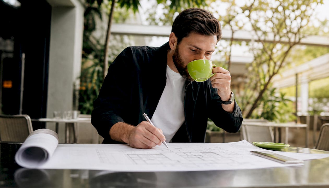Architect reviewing custom home blueprints
