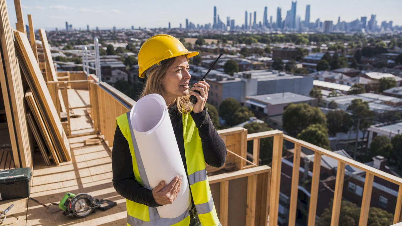 Project manager coordinating home construction site