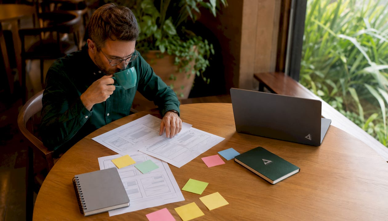 Web developer reviewing website audit data at desk