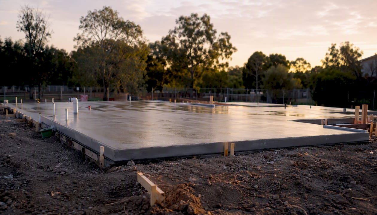 Fresh concrete slab foundation poured on site