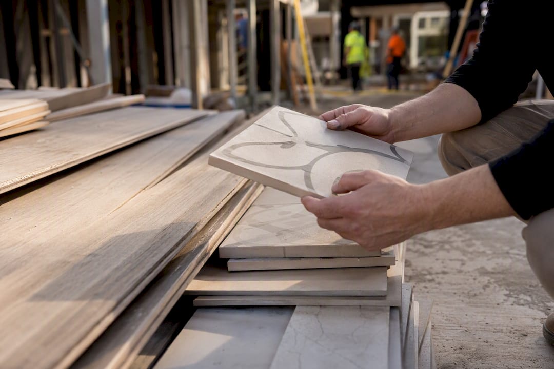 Hands inspecting renovation materials on site