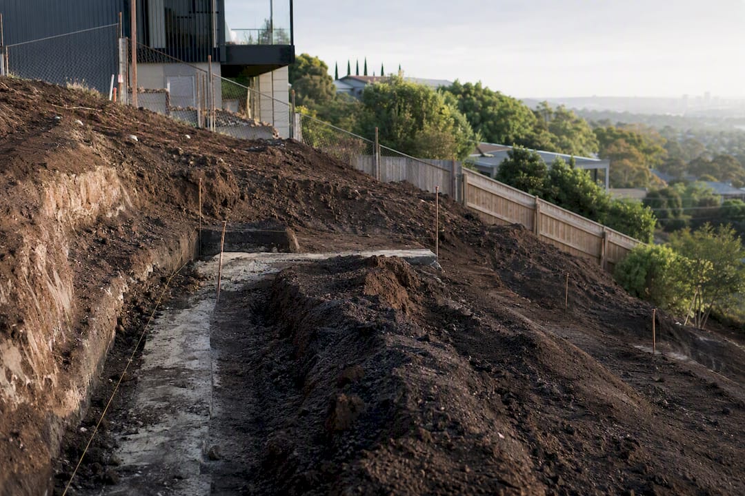 Sloping building site with excavation and soil detail