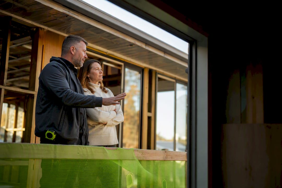 Homeowner inspecting completed construction stage