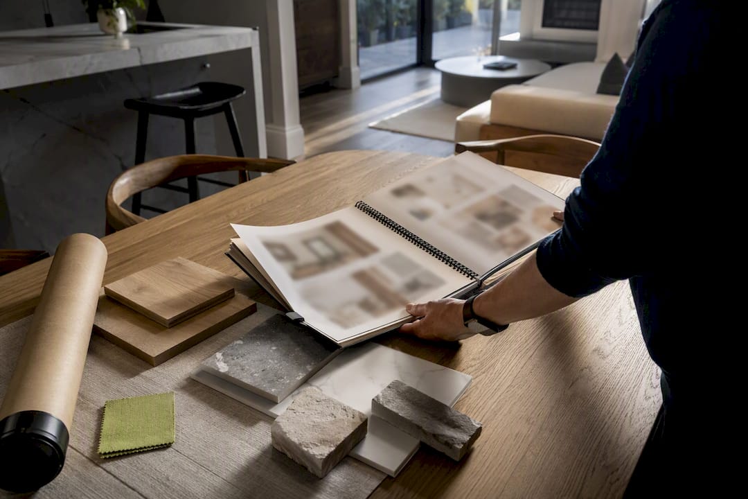 Homeowner arranging renovation material samples