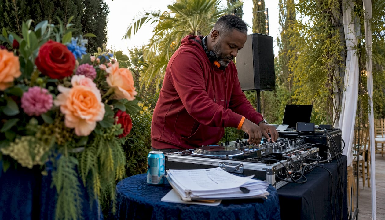 DJ preparing multicultural event equipment