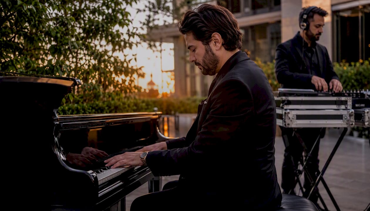 Pianist playing with DJ setting up in background