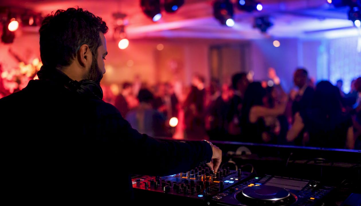 DJ reading dance floor energy during event