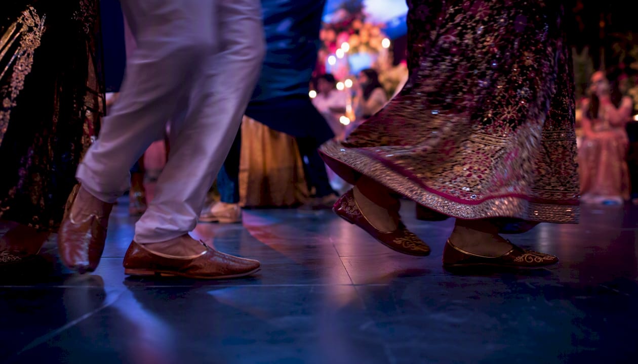 Dancing feet moving on wedding dance floor