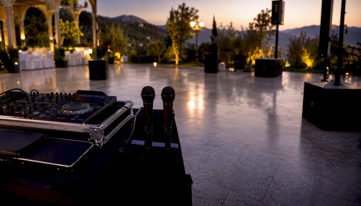 Wedding DJ sound system setup with mixer and mics