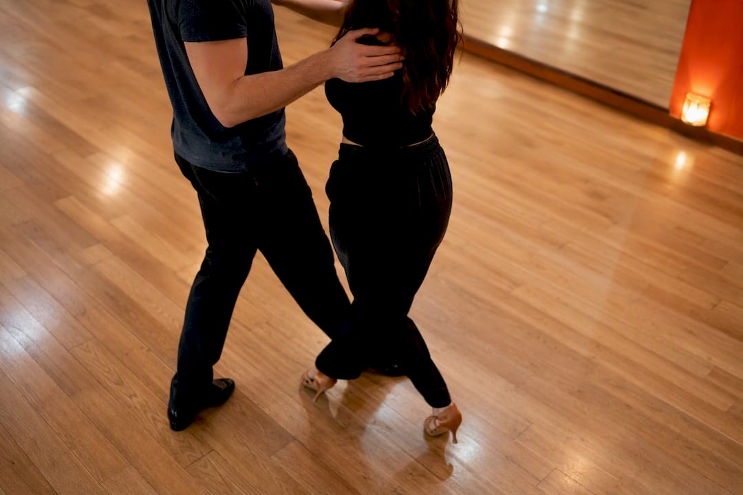 Couple's feet practicing dance steps