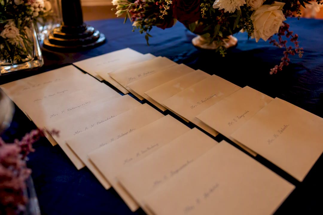 Stack of labeled tip envelopes on wedding table