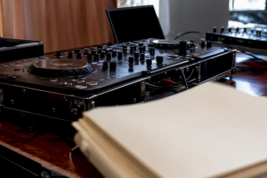 DJ equipment with insurance paperwork blur