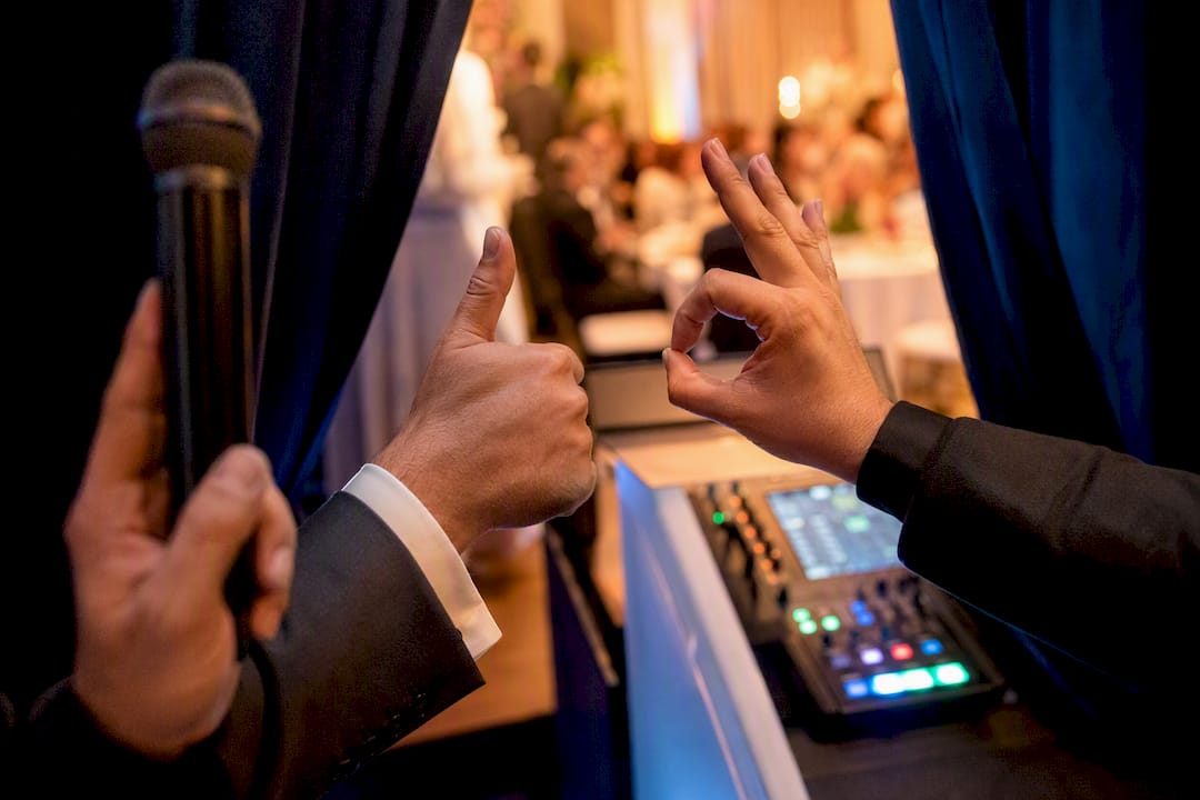 Emcee and DJ exchanging timing signal