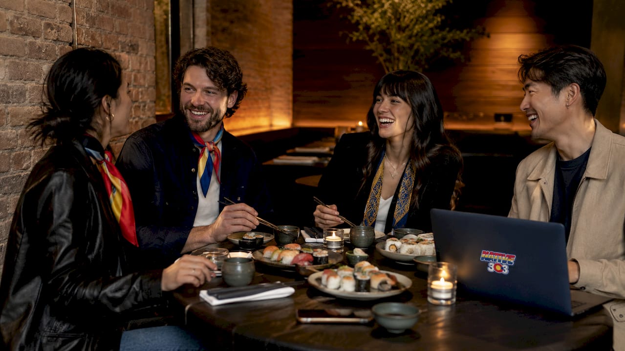 Group enjoying Uchiko Denver with warm fashion styles