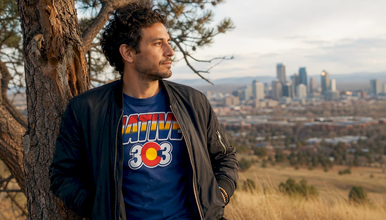 Man in vintage denim and striped tee outdoors in Denver